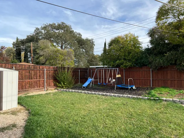 a view of a backyard with garage