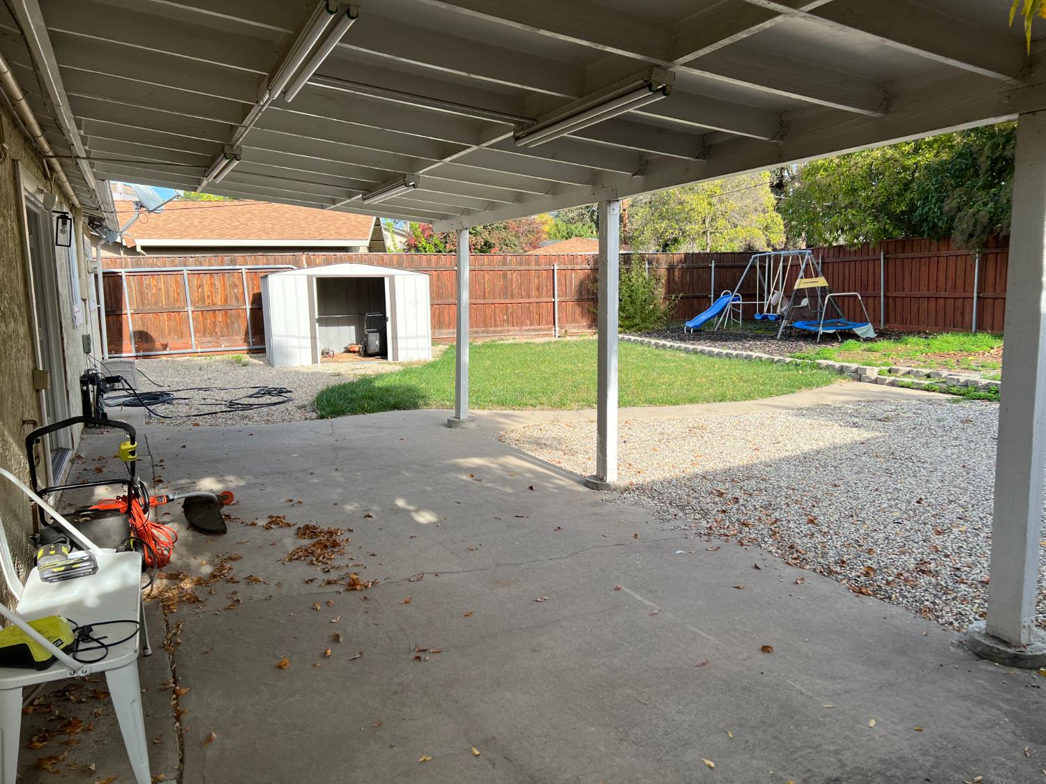 8024 Lesser Way Citrus Heights, CA 95621 - Photo 25 of 32 a view of a house with backyard and porch