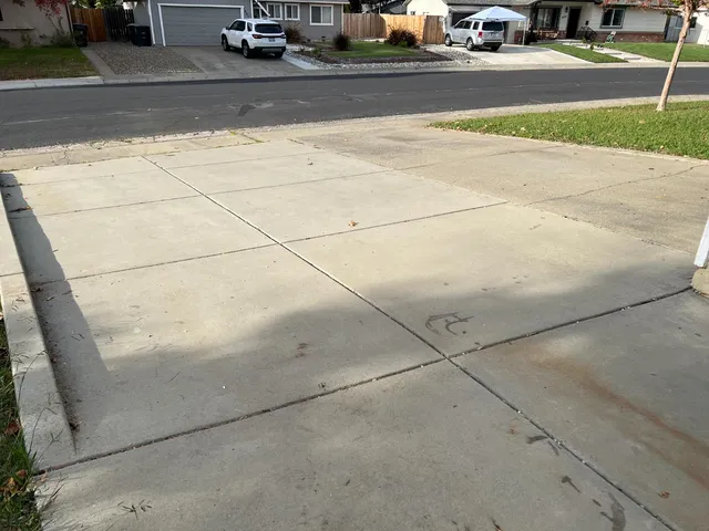 a kitchen with granite countertop white cabinets and stainless steel appliances