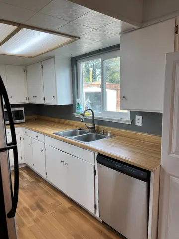 a kitchen with a stove and a microwave