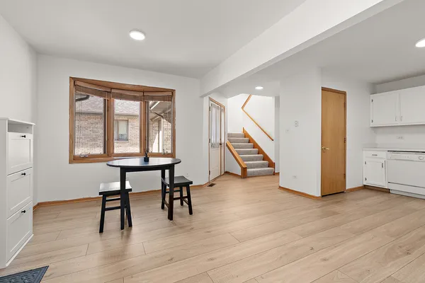 a view of a livingroom with furniture and a workspace