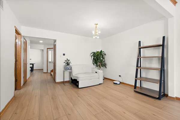 an entryway and livingroom with furniture
