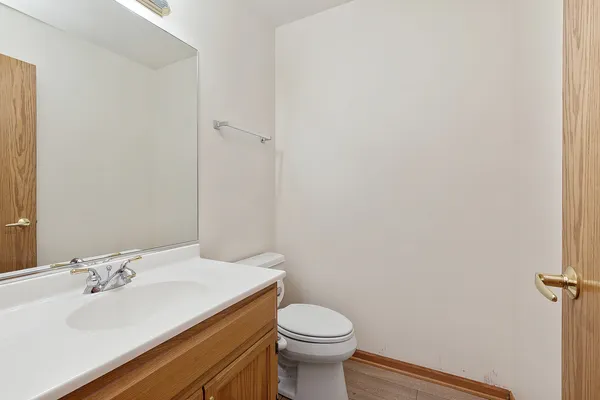 a bathroom with a sink toilet and vanity
