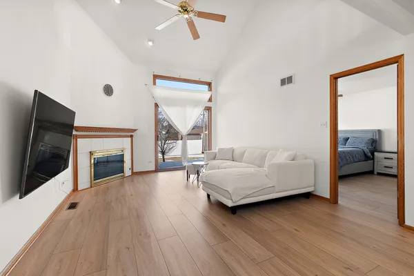 a living room with furniture and a fireplace