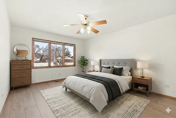 a bedroom with a large bed and a window
