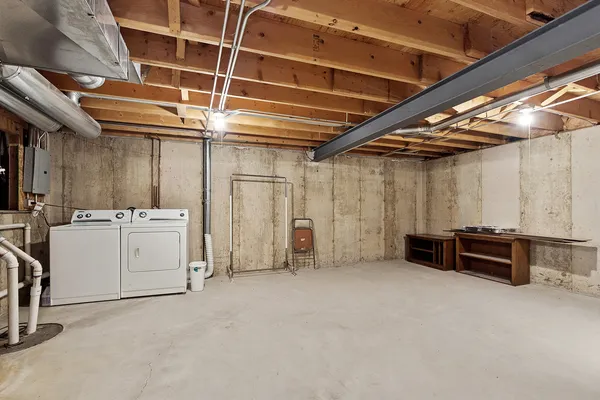 a view of an empty room with white walls