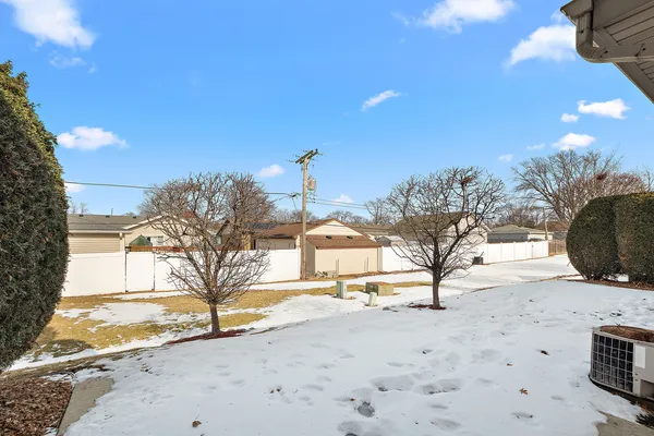 a view of a house with a snow in the yard