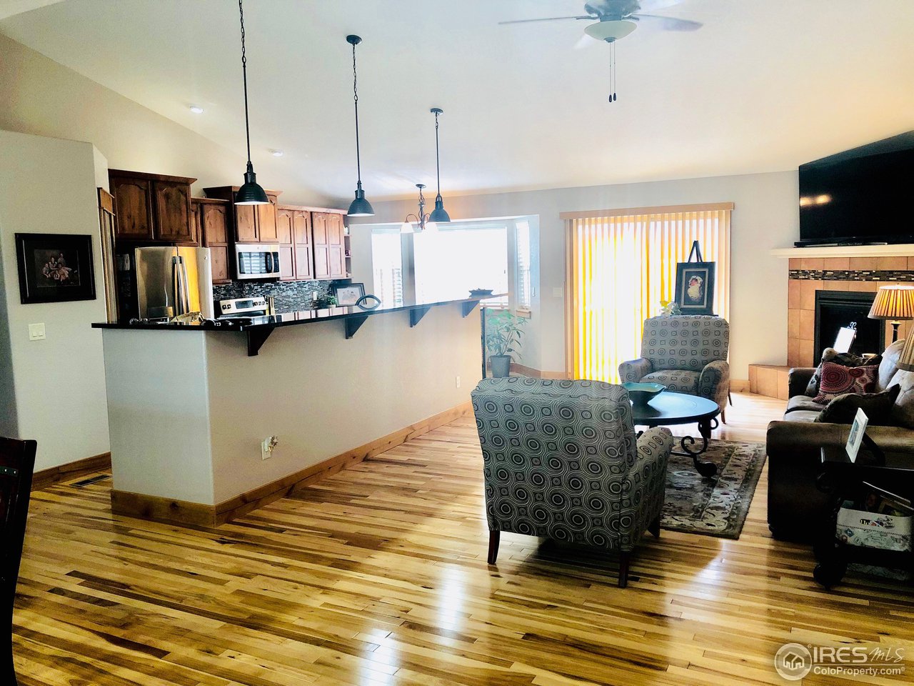 333 Braveheart Road Johnstown, CO 80534 - Photo 7 of 32 Hickory Hardwood Floors and Cabinets