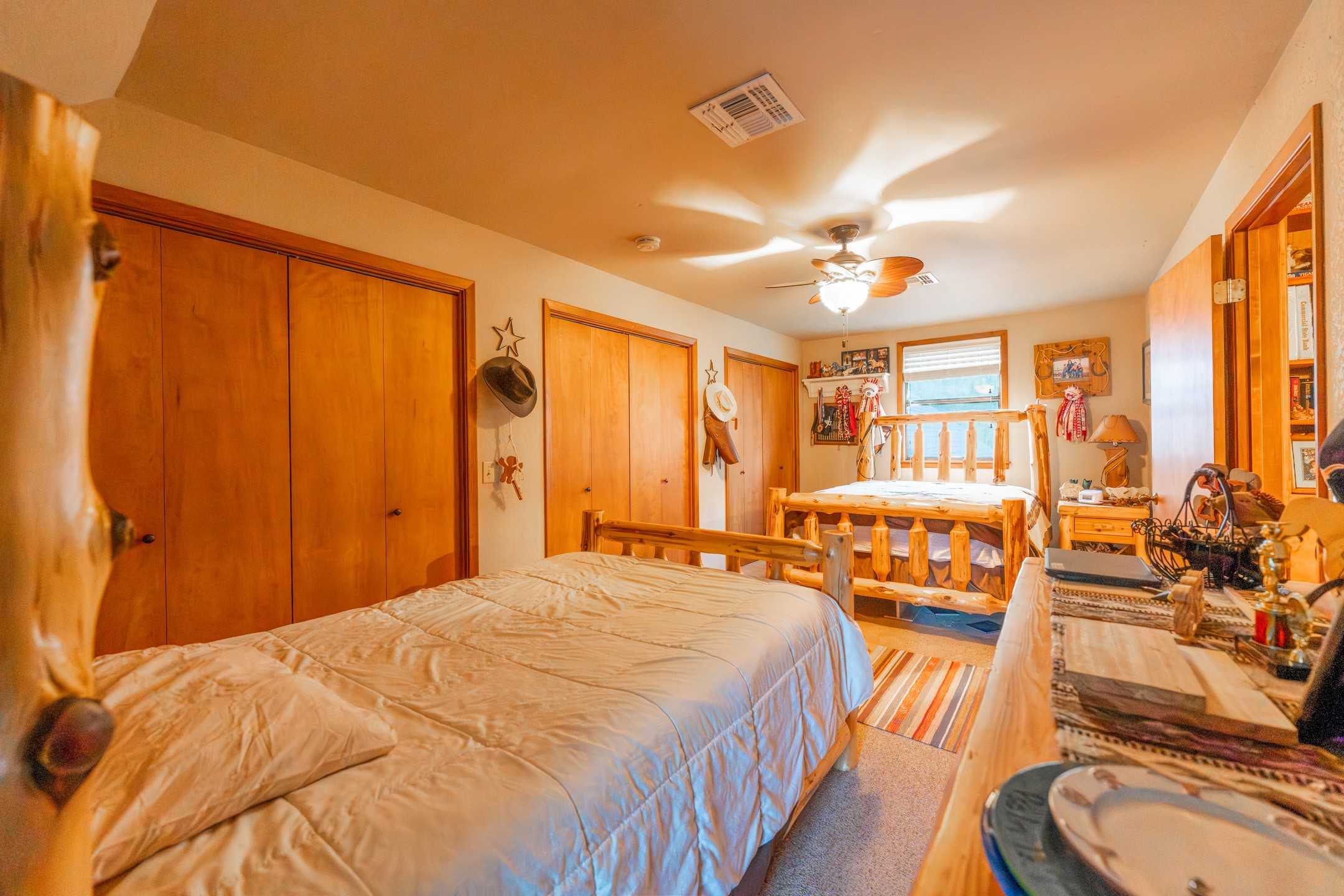 2210 Rita Street El Campo, TX 77437 - Photo 13 of 22 a bed room with a bed and a chandelier