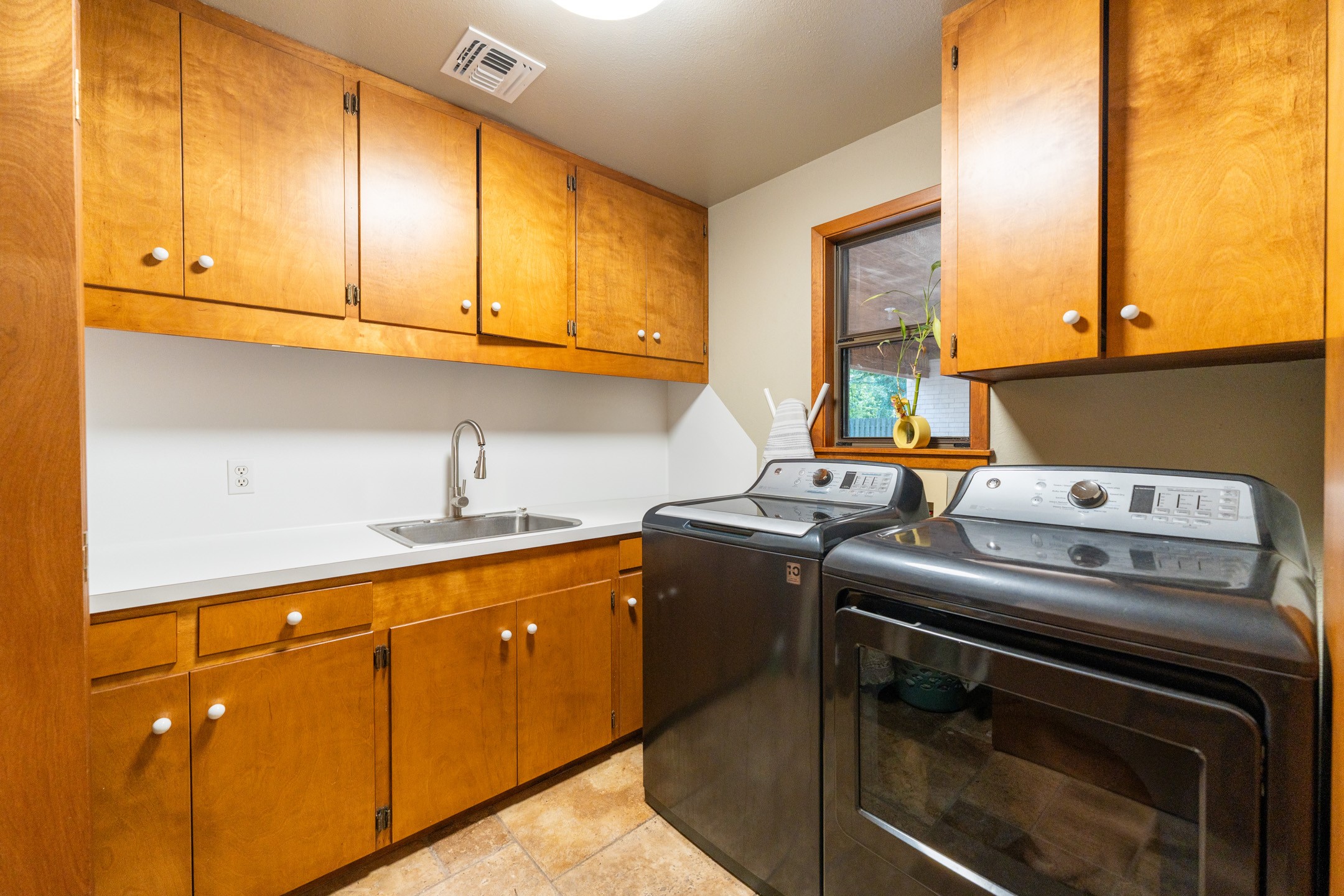 2210 Rita Street El Campo, TX 77437 - Photo 16 of 22 a kitchen with stainless steel appliances granite countertop a stove a sink and a microwave