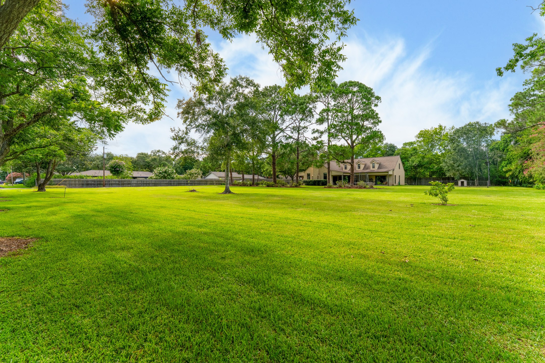 2210 Rita Street El Campo, TX 77437 - Photo 17 of 22 a view of a green field with trees in the background