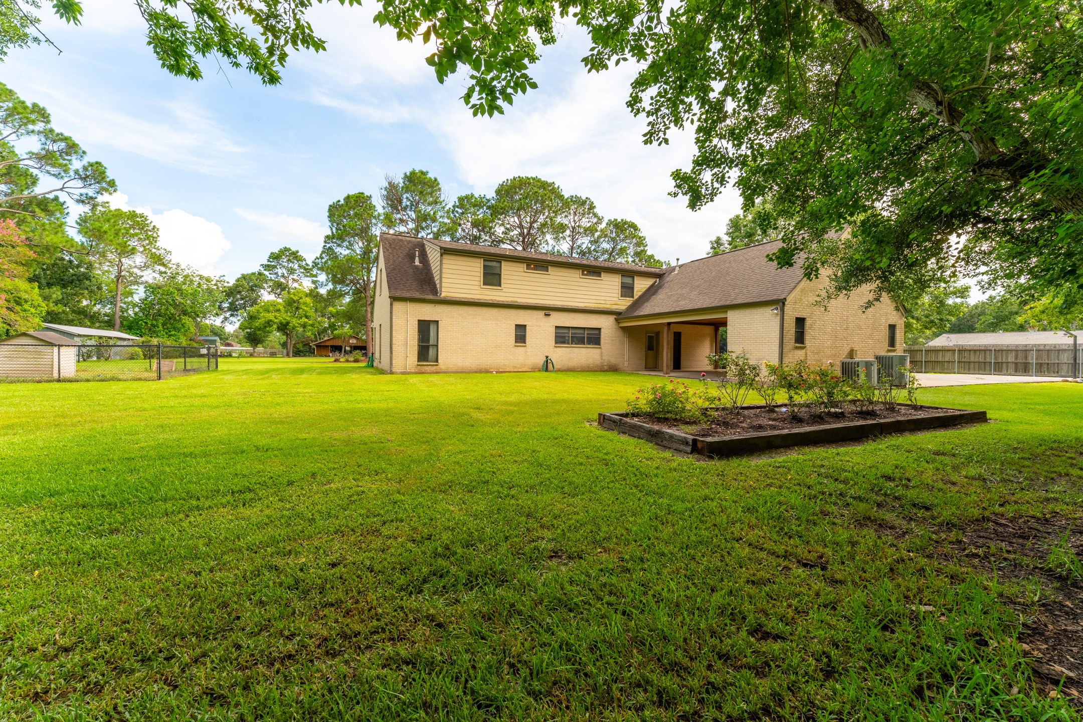 2210 Rita Street El Campo, TX 77437 - Photo 20 of 22 a view of a house with a big yard