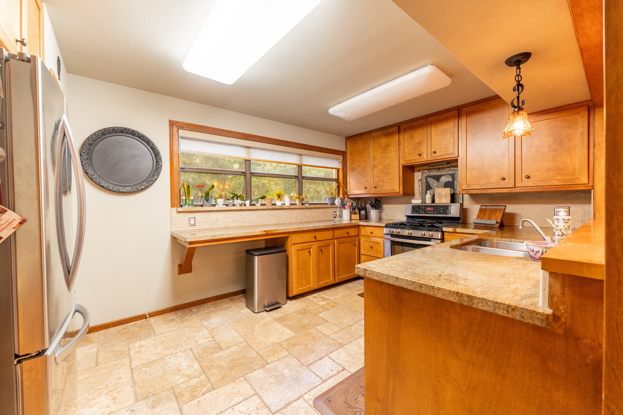 2210 Rita Street El Campo, TX 77437 - Photo 7 of 22 a kitchen with a sink appliances cabinets and a large window