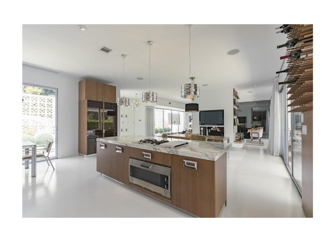 1030 San Rafael Lane Pasadena, CA 91105 - Photo 16 of 56 a kitchen with stainless steel appliances granite countertop a stove oven and a refrigerator