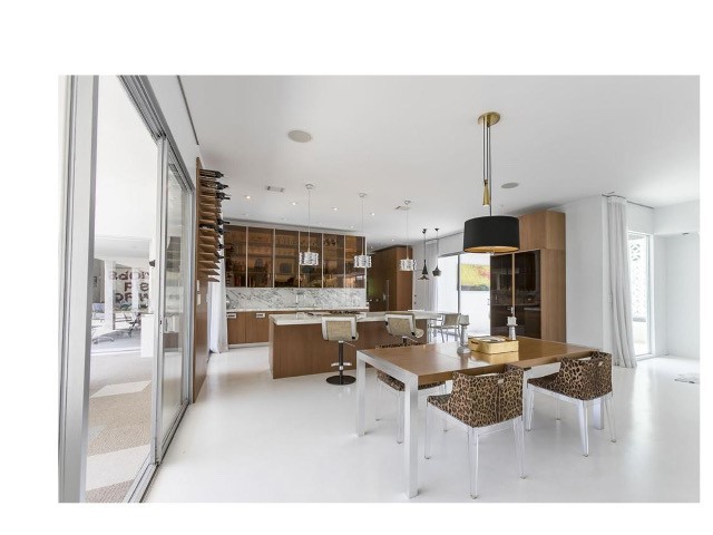 1030 San Rafael Lane Pasadena, CA 91105 - Photo 18 of 56 a living room with furniture a flat screen tv and a large window