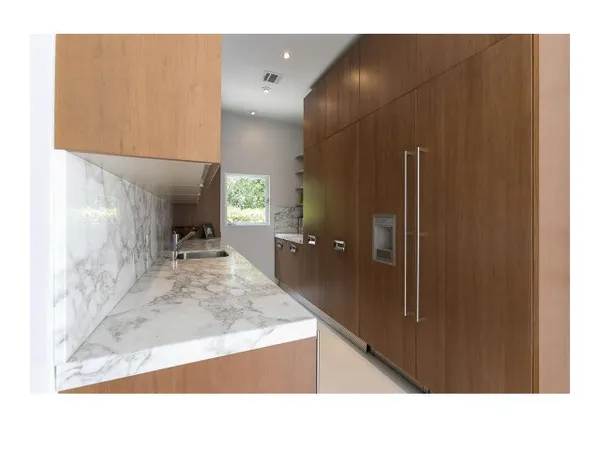 a open kitchen with stainless steel appliances granite countertop a sink stove and refrigerator