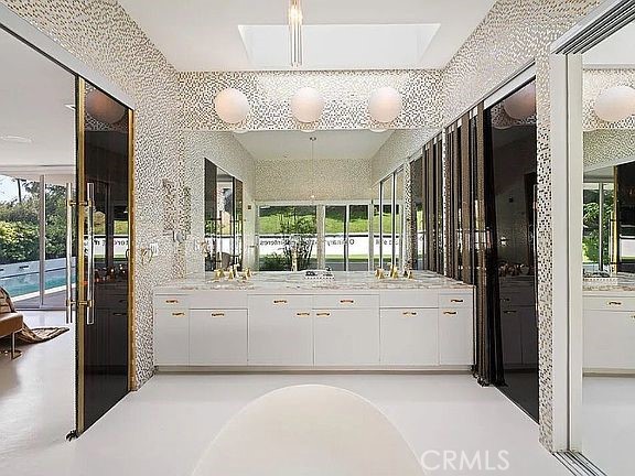 1030 San Rafael Lane Pasadena, CA 91105 - Photo 31 of 56 a large white kitchen with a large window