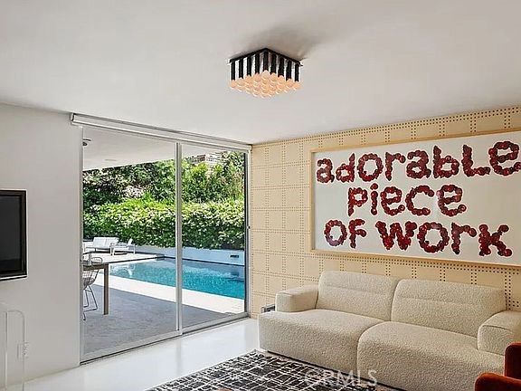 1030 San Rafael Lane Pasadena, CA 91105 - Photo 32 of 56 a living room with furniture and a floor to ceiling window