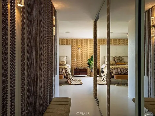a bathroom with a tub and a view of bathroom