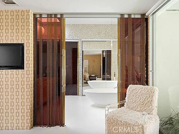 1030 San Rafael Lane Pasadena, CA 91105 - Photo 36 of 56 a living room with furniture and a flat screen tv