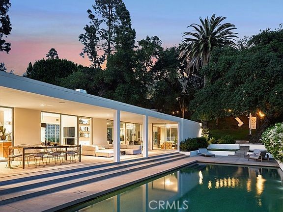 1030 San Rafael Lane Pasadena, CA 91105 - Photo 39 of 56 a view of swimming pool with a table and chairs under an umbrella