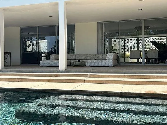 a view of a patio with a table and chairs