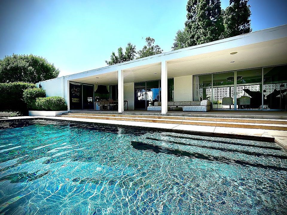 1030 San Rafael Lane Pasadena, CA 91105 - Photo 41 of 56 a front view of a house with a yard table and chairs