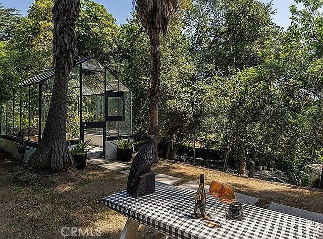 1030 San Rafael Lane Pasadena, CA 91105 - Photo 43 of 56 a view of a patio with a table and chairs