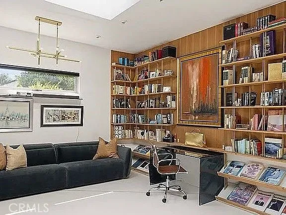 a reading room with furniture and book shelf