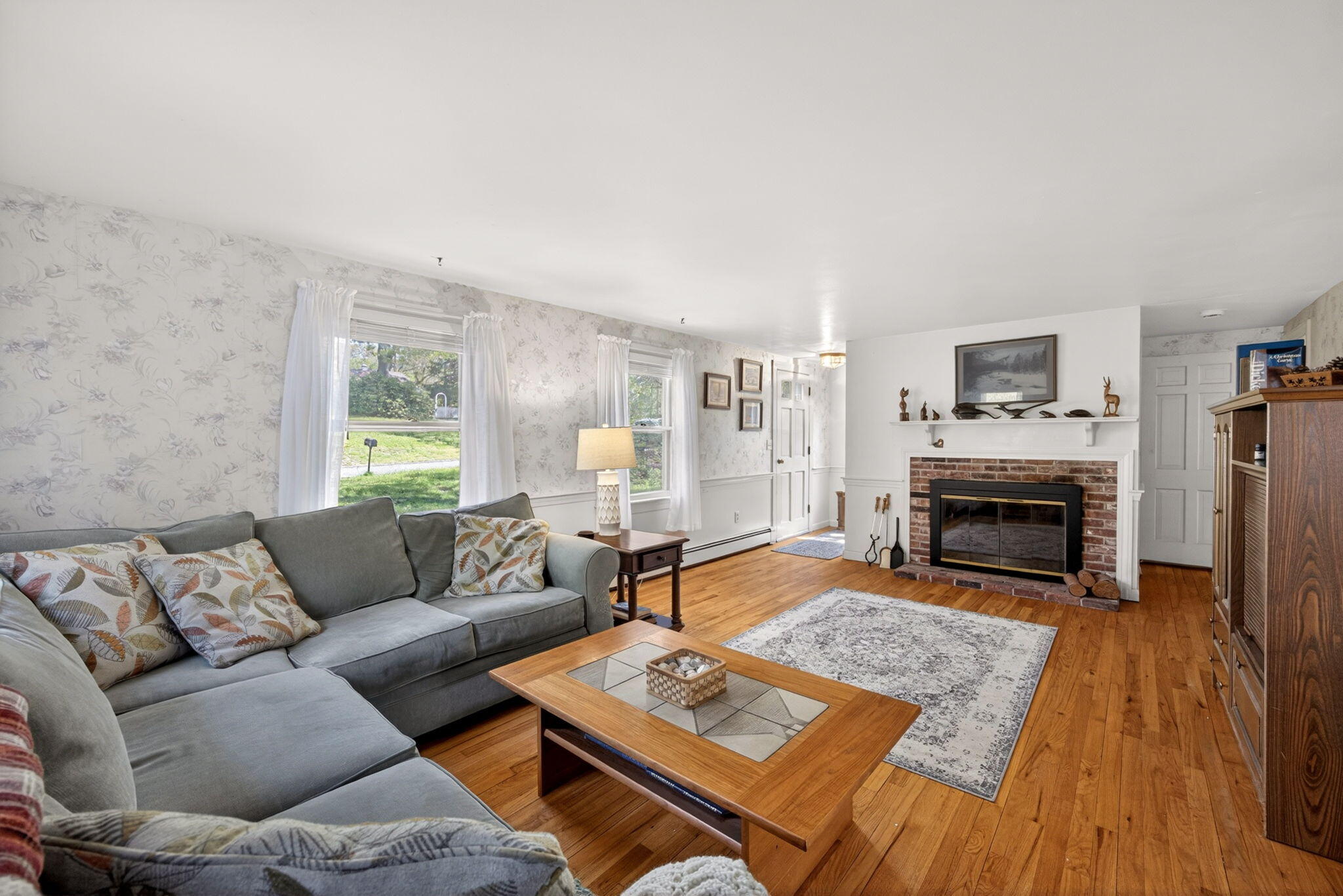 23 Nickerson Road Orleans, MA 02653 - Photo 5 of 54 a living room with furniture and a fireplace