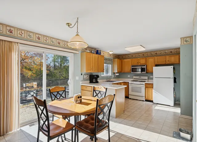 a kitchen with a sink cabinets and appliances
