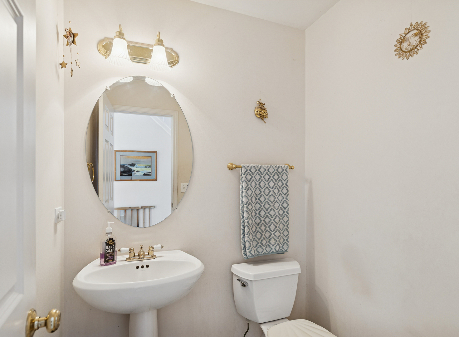 885 Charlton Road Lake Villa, IL 60046 - Photo 13 of 31 a bathroom with a toilet sink and mirror