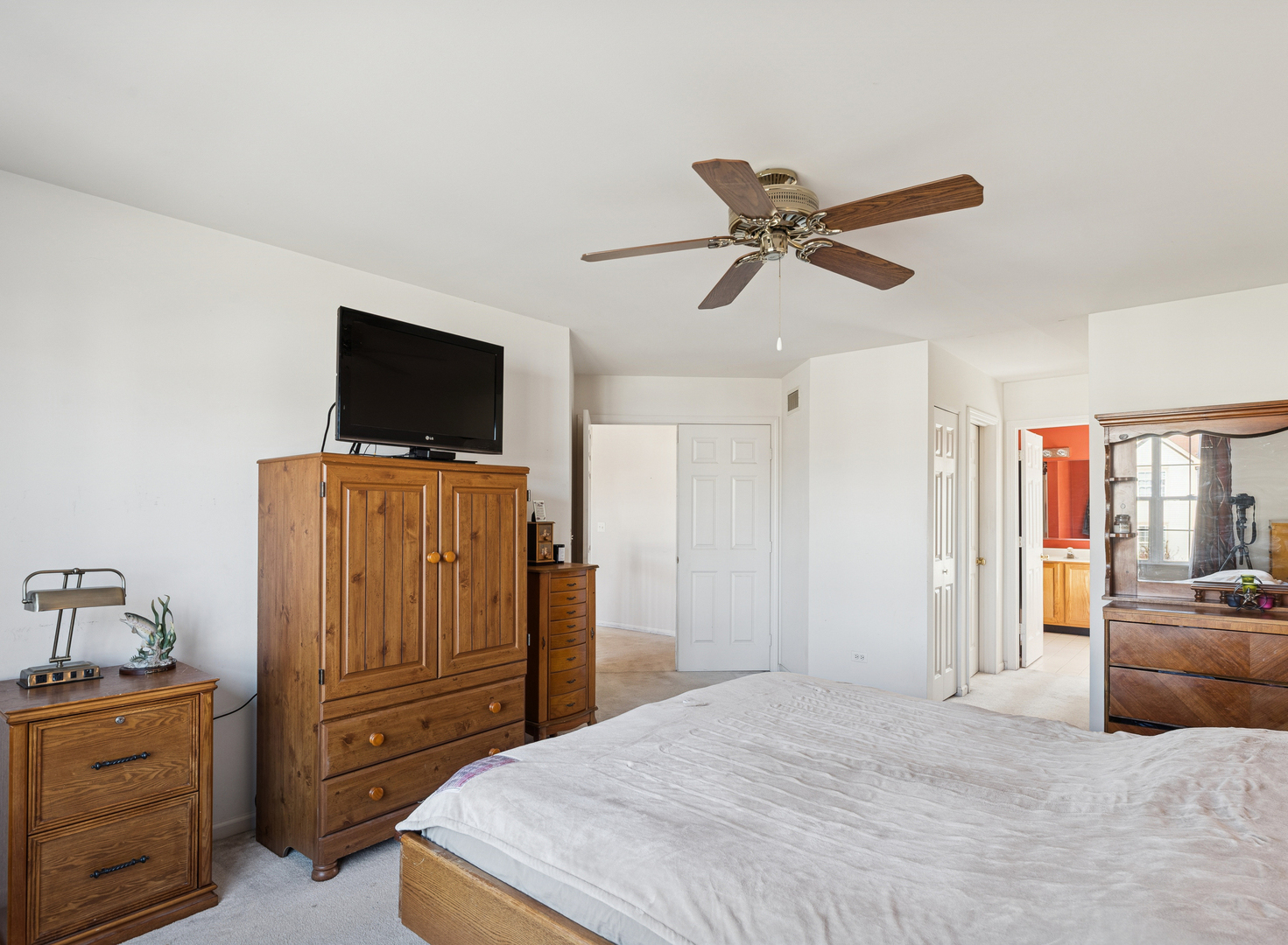 885 Charlton Road Lake Villa, IL 60046 - Photo 17 of 31 a bedroom with a bed and a television