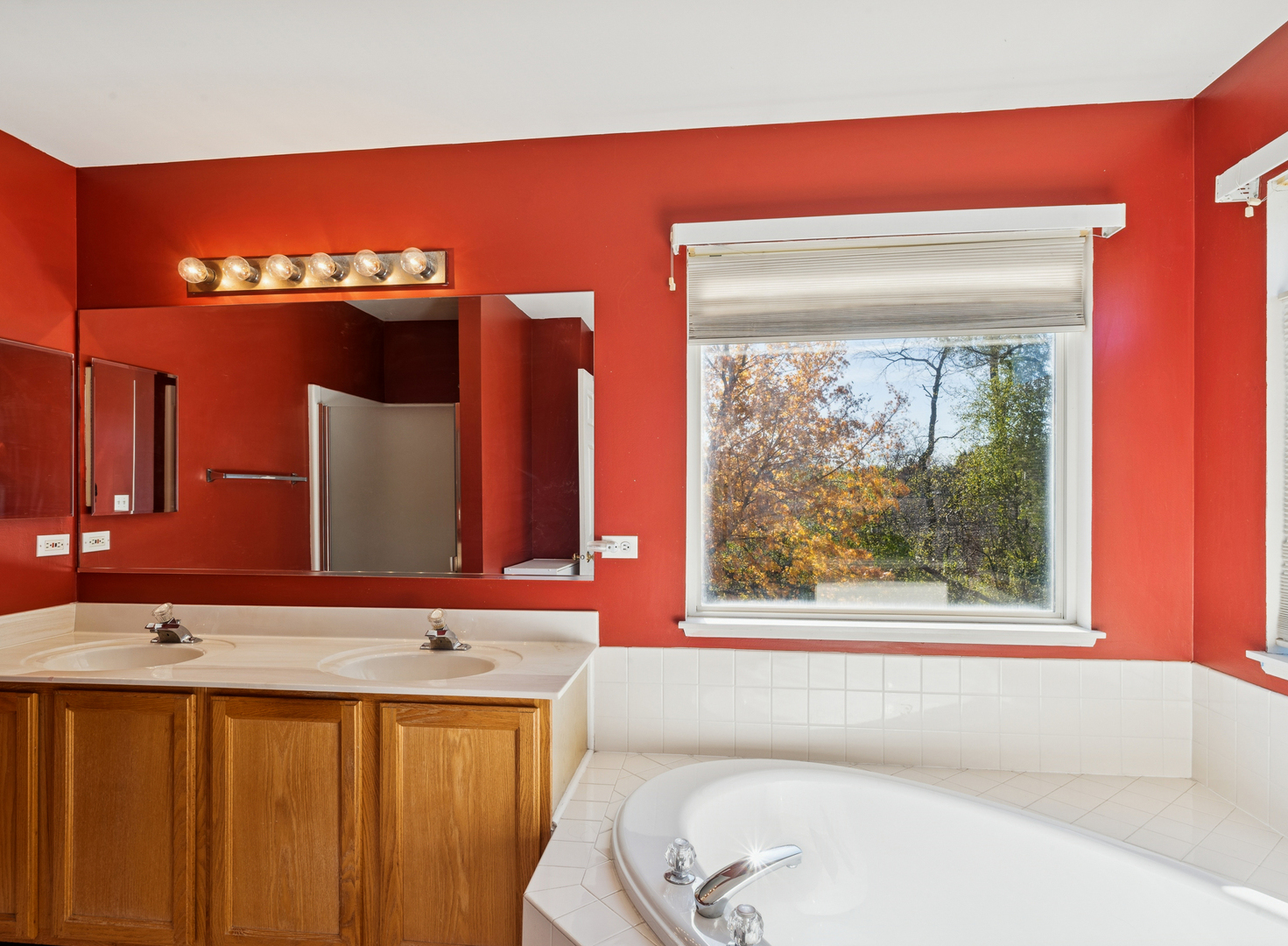 885 Charlton Road Lake Villa, IL 60046 - Photo 18 of 31 a bathroom with a bathtub and a sink