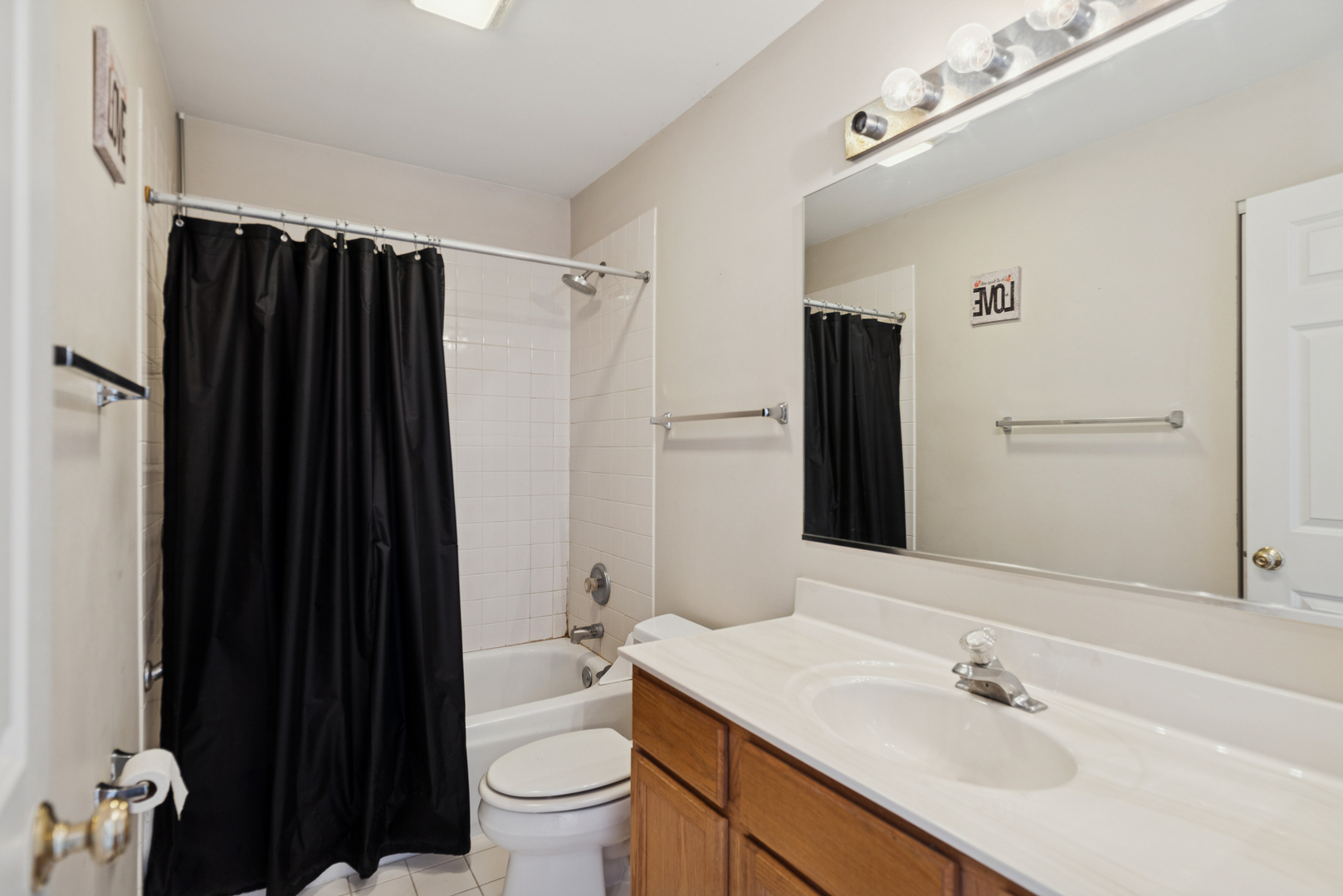 885 Charlton Road Lake Villa, IL 60046 - Photo 22 of 31 a bathroom with a sink a toilet and shower