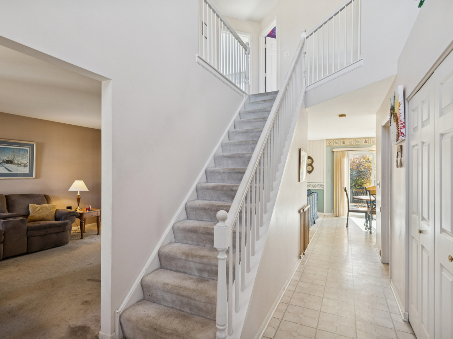 885 Charlton Road Lake Villa, IL 60046 - Photo 3 of 31 a view of a livingroom with furniture and stairs