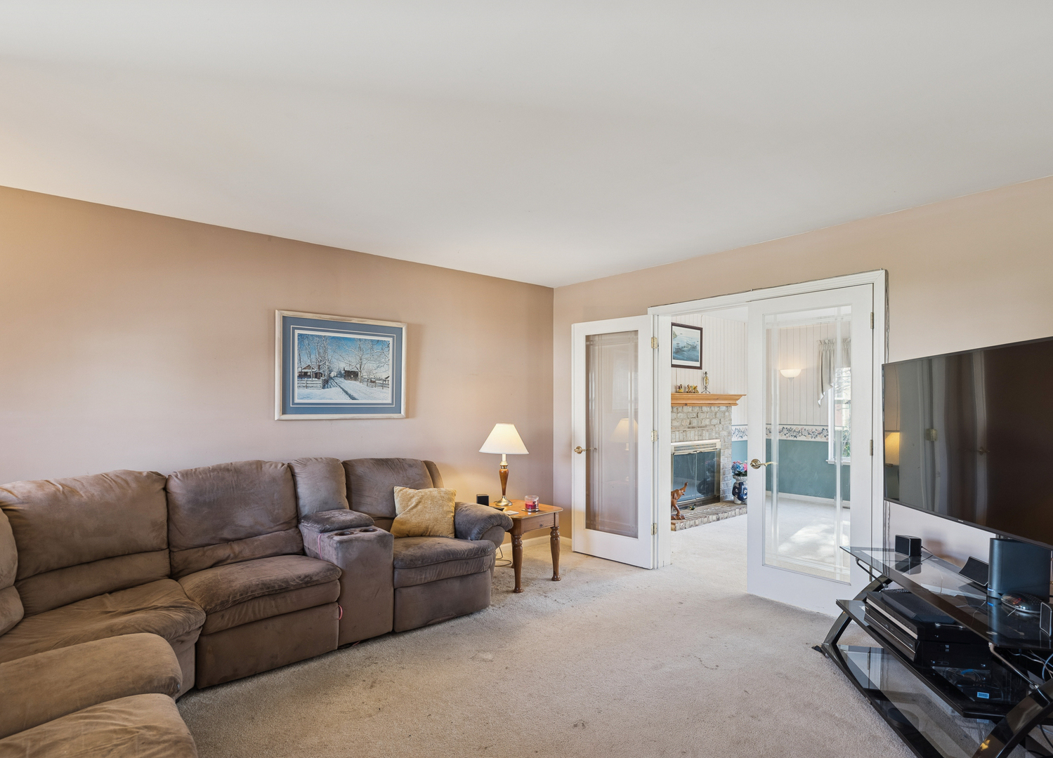 885 Charlton Road Lake Villa, IL 60046 - Photo 6 of 31 a living room with furniture and a flat screen tv