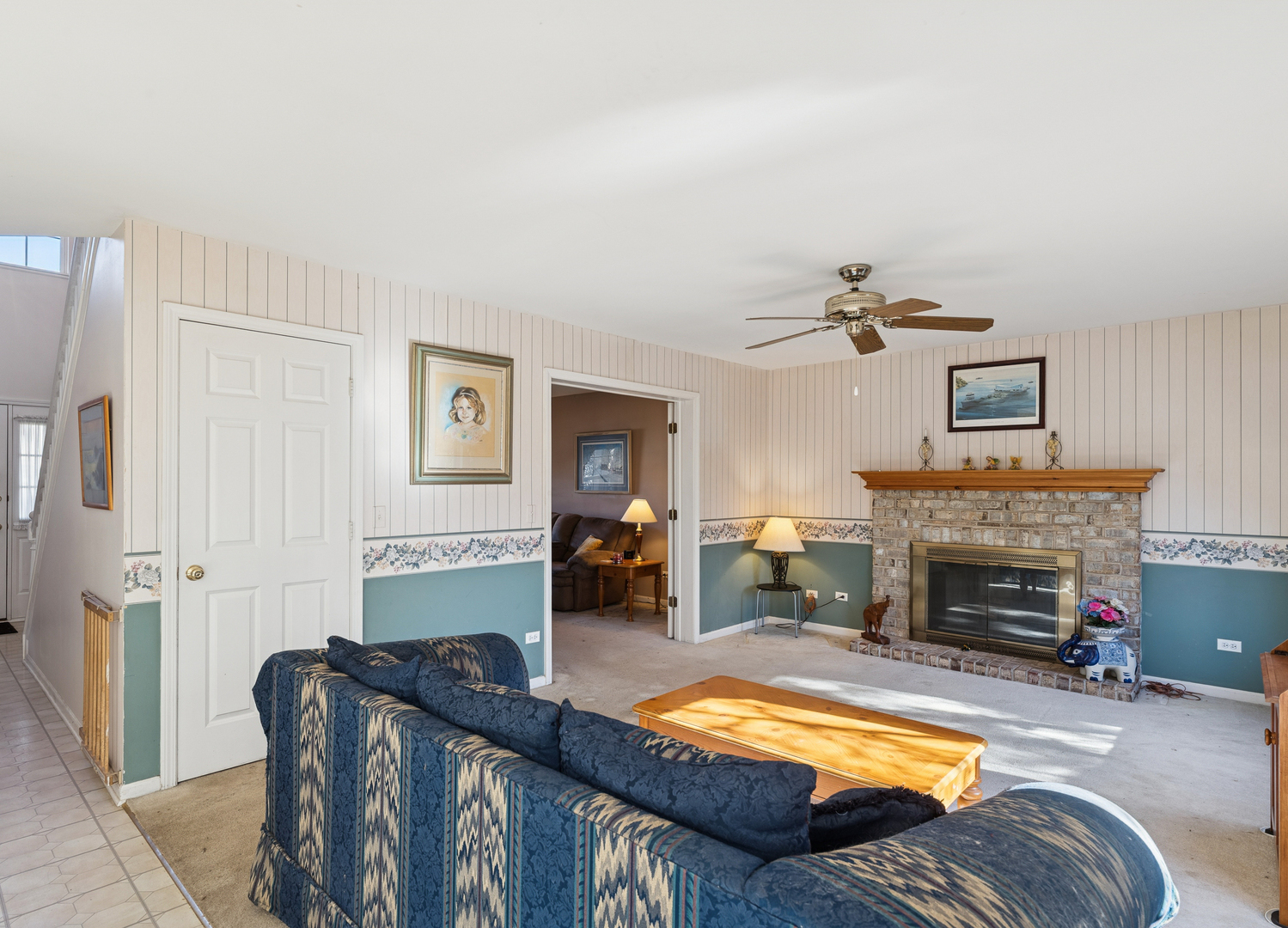 885 Charlton Road Lake Villa, IL 60046 - Photo 9 of 31 a living room with furniture and a fireplace