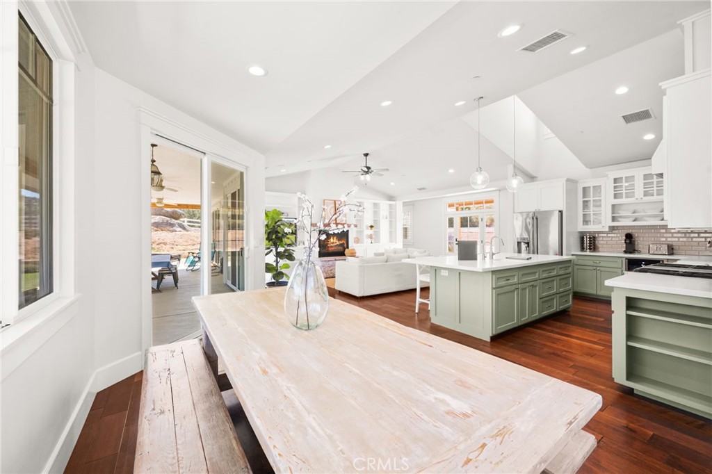 41260 De Anna Ranch Road Murrieta, CA 92562 - Photo 12 of 57 a large kitchen with a table and chairs
