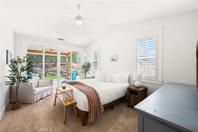 a bedroom with a bed and a table