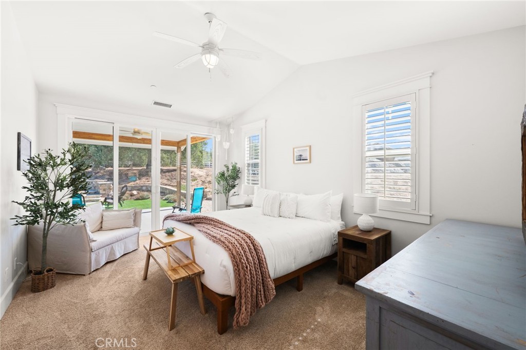 41260 De Anna Ranch Road Murrieta, CA 92562 - Photo 15 of 57 a bedroom with a bed and a table
