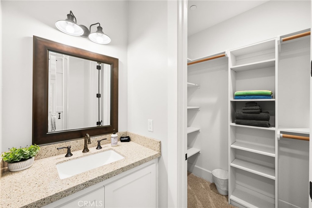 41260 De Anna Ranch Road Murrieta, CA 92562 - Photo 25 of 57 a bathroom with a sink and a mirror