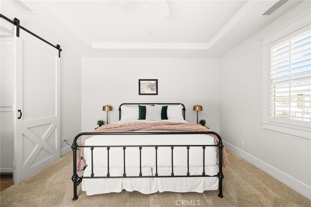41260 De Anna Ranch Road Murrieta, CA 92562 - Photo 27 of 57 a bedroom with a bed and a window