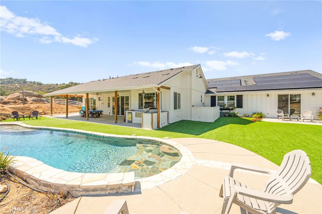 41260 De Anna Ranch Road Murrieta, CA 92562 - Photo 36 of 57 a view of a house with a swimming pool
