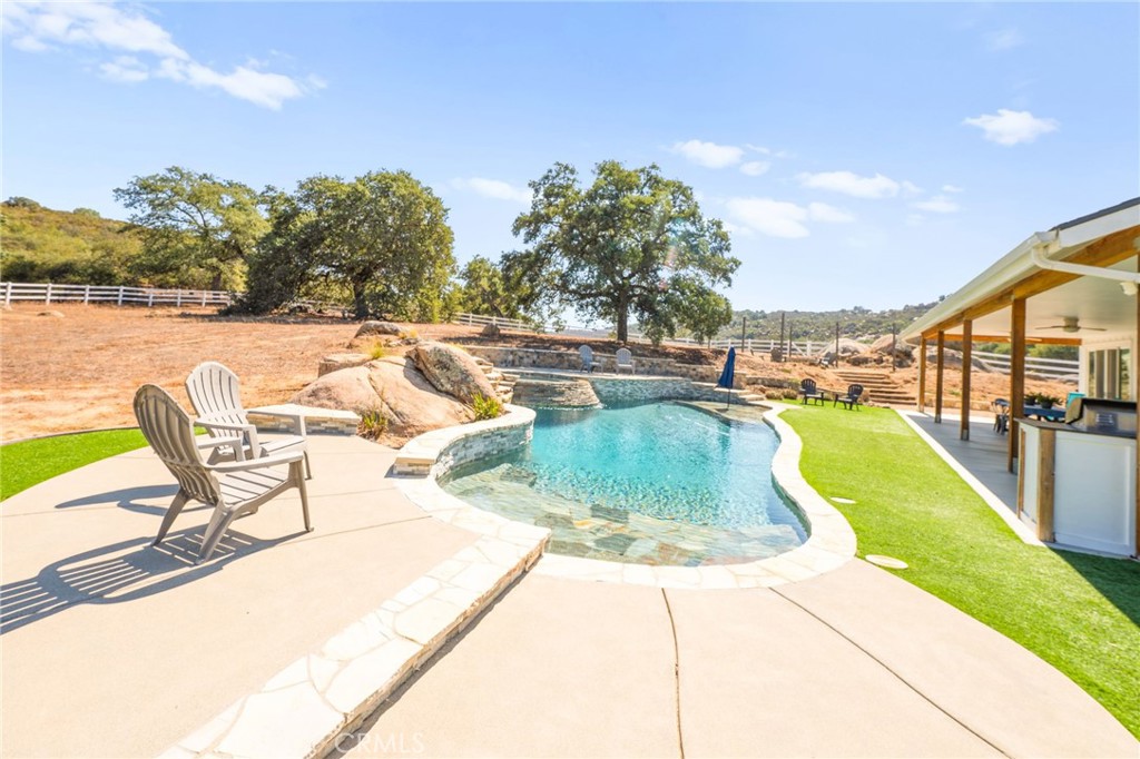 41260 De Anna Ranch Road Murrieta, CA 92562 - Photo 37 of 57 a view of a swimming pool with lounge chair