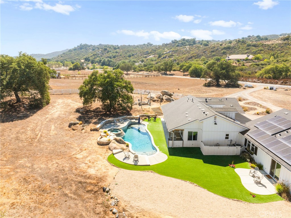 41260 De Anna Ranch Road Murrieta, CA 92562 - Photo 39 of 57 an aerial view of a house with a ocean view