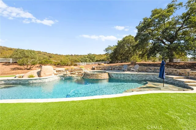 a view of a lake with houses in the back