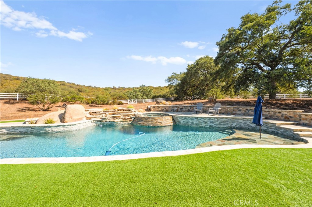 41260 De Anna Ranch Road Murrieta, CA 92562 - Photo 4 of 57 a view of a lake with houses in the back