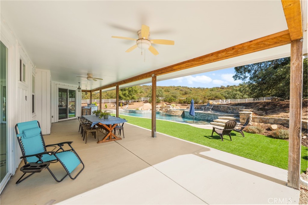 41260 De Anna Ranch Road Murrieta, CA 92562 - Photo 41 of 57 a view of a patio with a table chairs and garden