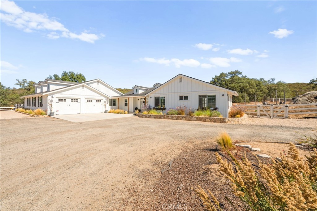 41260 De Anna Ranch Road Murrieta, CA 92562 - Photo 45 of 57 a view of white house with a big yard and large trees